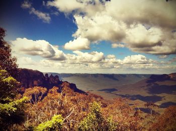 Scenic view of landscape and sea against sky