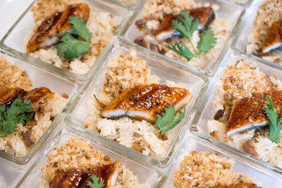 High angle view of rice and meat in tray