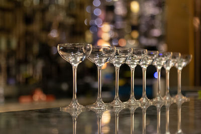 Close-up of wine glasses on table