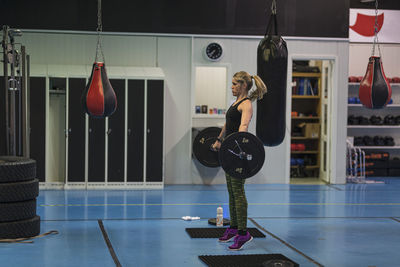 Woman weightlifting in gym