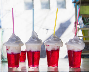 Row of red gelatin with whipped cream desserts, potosi, bolivia