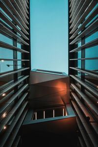 Low angle view of building against clear blue sky