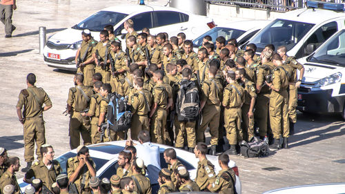 Police force standing on street