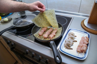 High angle view of man preparing food in kitchen