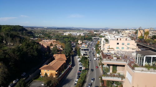 High angle view of street amidst buildings in city