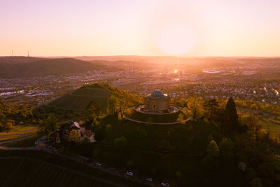 High angle view of city against sky during sunset