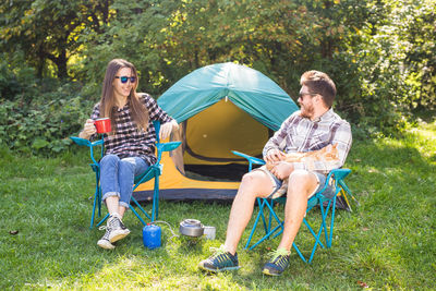 Men sitting in tent