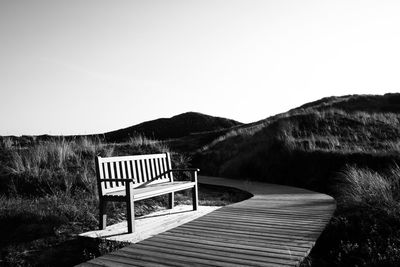 Lifeguard hut on land against clear sky