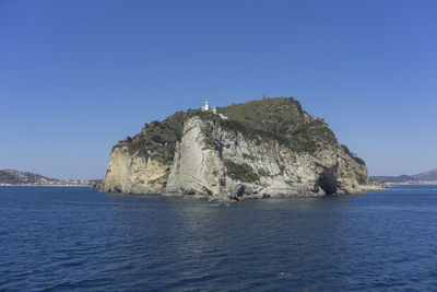 Scenic view of sea against clear blue sky