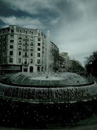 Fountain with buildings in background