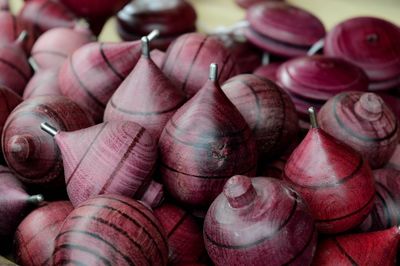 Close-up of wooden spinning tops in workshop