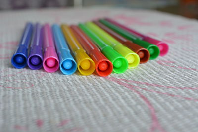 Close-up of multi colored pencils on table