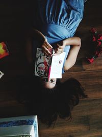 High angle view of woman sitting at home