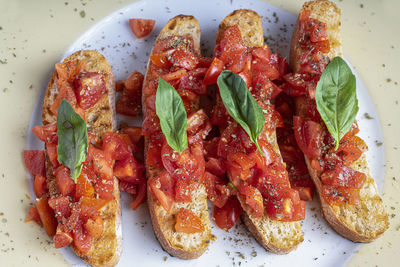 Bruschetta with tomato and basil. isolated image