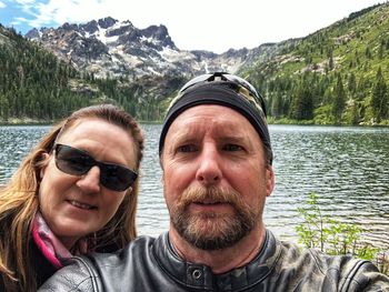 Portrait of smiling man with sunglasses in lake