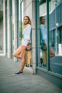 Full length of woman standing in city