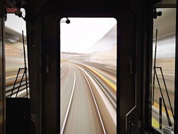 Railroad track seen through train windshield