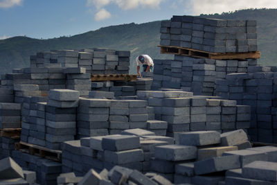 Full length of man standing on stone structure