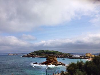 Scenic view of sea against cloudy sky