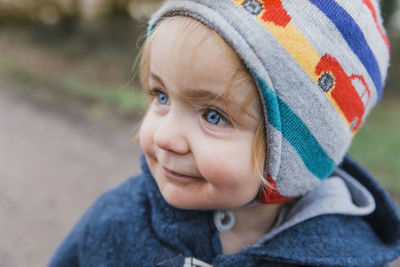 Close-up of innocent girl looking away