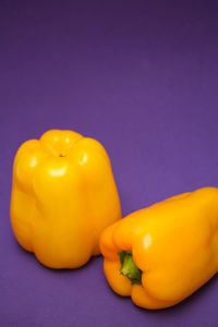 Close-up of yellow bell peppers on table