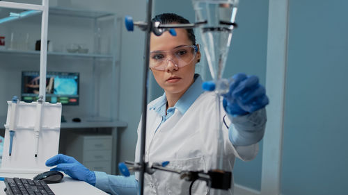 Female scientist experimenting in laboratory