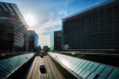 Street traffic in brussels with modern buildings