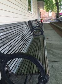 Close-up of bicycle parked in front of bench