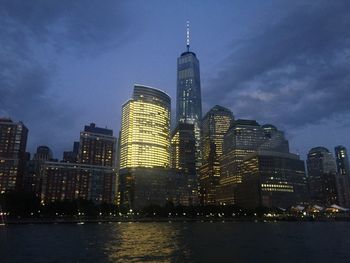 View of skyscrapers lit up at night