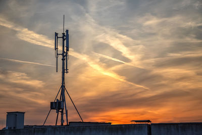 Low angle view of silhouette building against sky during sunset