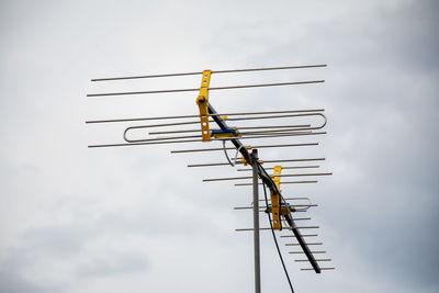 Low angle view of antenna against sky