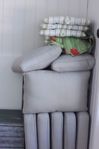 Stack of sofa on wall at home