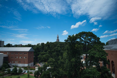 Buildings against blue sky and clouds