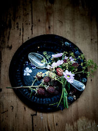 High angle view of raspberries in bowl on table