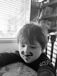 Portrait of boy looking at home