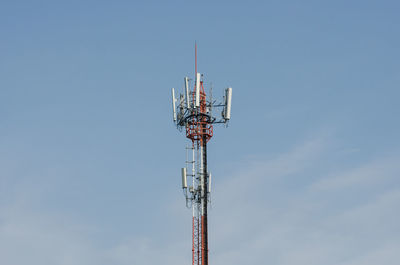 Low angle view of communications tower against sky