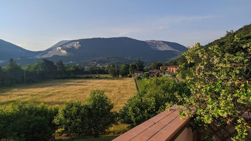 Scenic view of landscape and mountains against sky