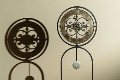 Low angle view of chandelier hanging on wall at home