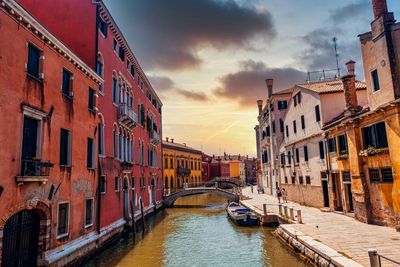 Canal passing through city buildings