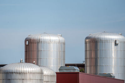 Smoke stacks against sky