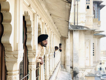 Side view of man in building window