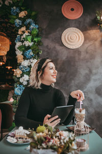 Woman holding coffee cup