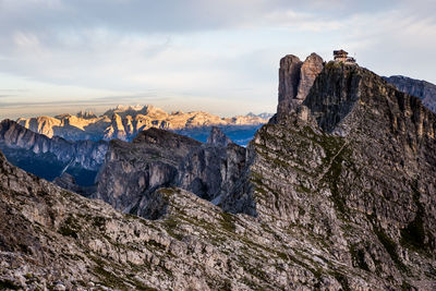 Scenic view of mountains against cloudy sky