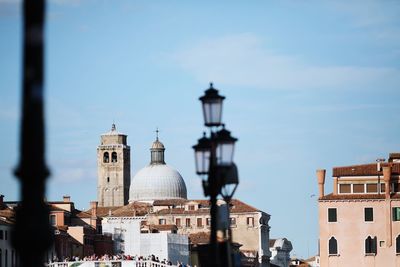 Buildings in city against sky