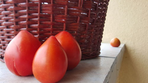 Close-up of fruits in basket on table