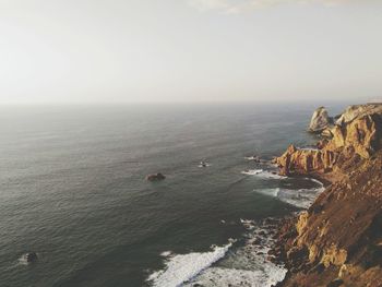 Scenic view of sea and cliff