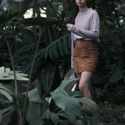 Woman standing by plants