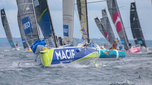 Boats in sea against sky