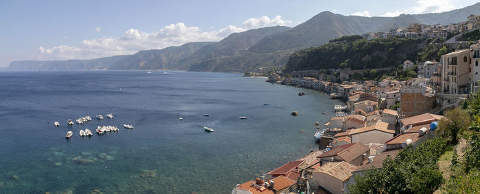 High angle view of sea and buildings against sky