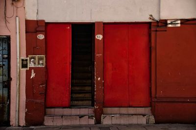 Closed red door of old building